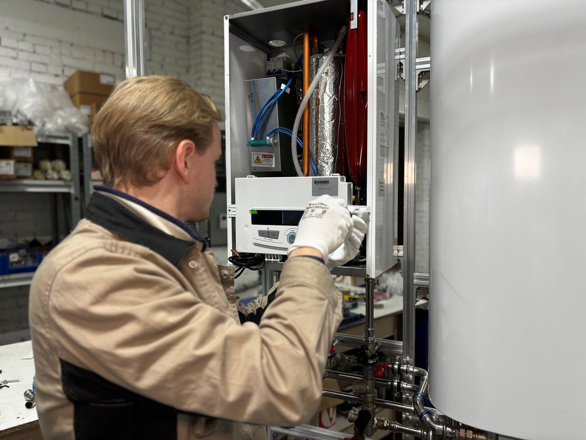A technician testing a heating system